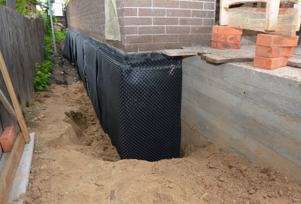 Happy homeowners after waterproofing job in Lakemore